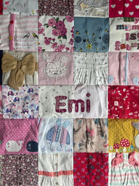 Cot size keepsake quilt made from babygrows